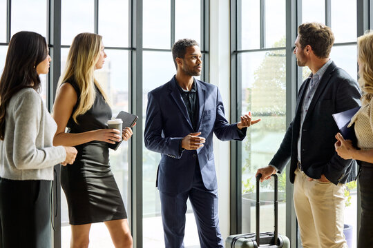Business Meeting Takes Place in Modern Office