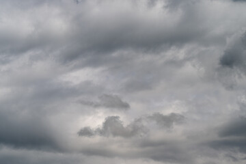 Fototapeta premium Clouds indicate rain. Gray clouds forecast imminent rain amidst maritime atmosphere clues. Layered sky with subtle hues reflects maritime weather cues and coastal navigation themes