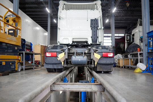 This image captures a modern truck positioned on a maintenance pit, showcasing the best practices in vehicle care and mechanical evaluations that are vital in today automotive industry.