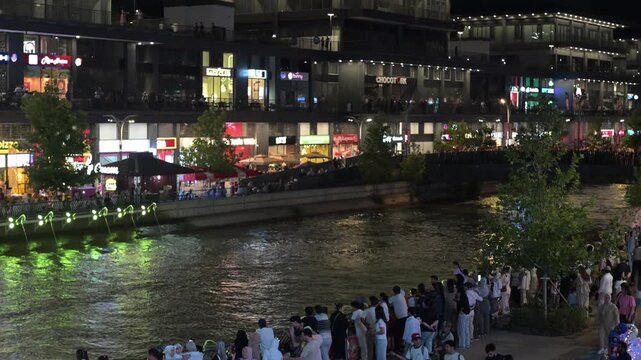 Tashkent, Uzbekistan - June 08, 2026: Seoul Mun Street.  Colorful fountain show with spectators enjoying evening performance.