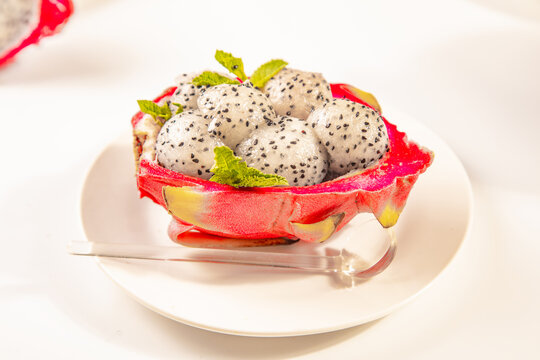 Dragon fruit balls in a halved dragon fruit shell
