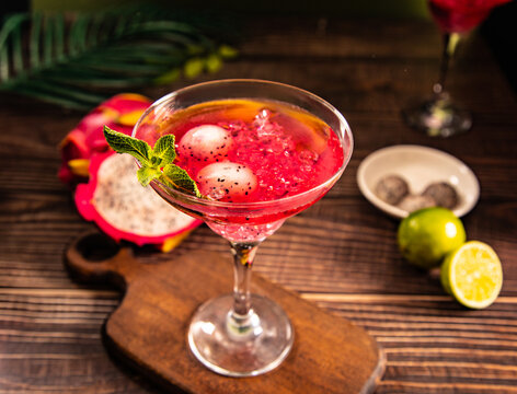 Vibrant dragon fruit cocktail with fresh garnish
