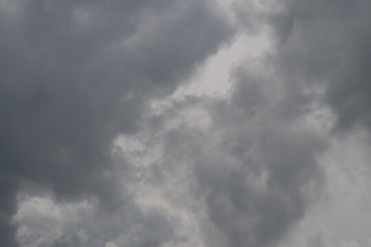 Squall front churns with rolling turbulence and rainbearing thunderhead shapes, whipping wind signatures and kinetic motion ideal for safety alerts and climate visuals