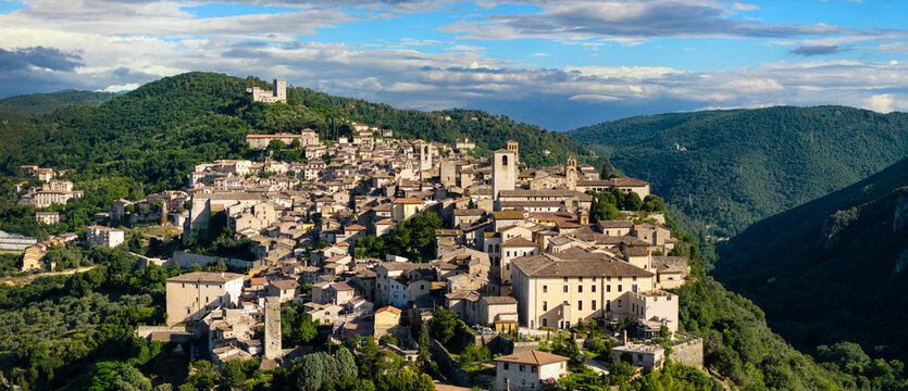 Narni medieval town drone panoramic view in Umbria Italy. Panorama aerial of historic hilltop stone houses and Rocca Albornoziana fortress nestled among green hills. World Print