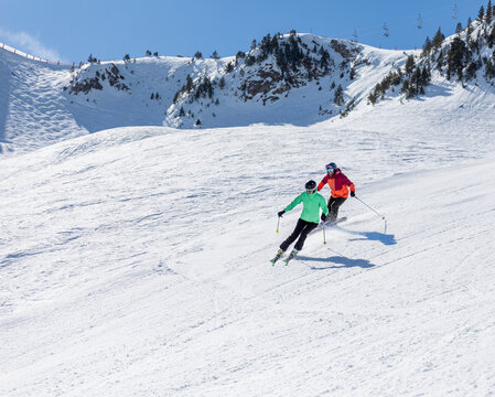 Skiing couple enjoying a mountain adventure together