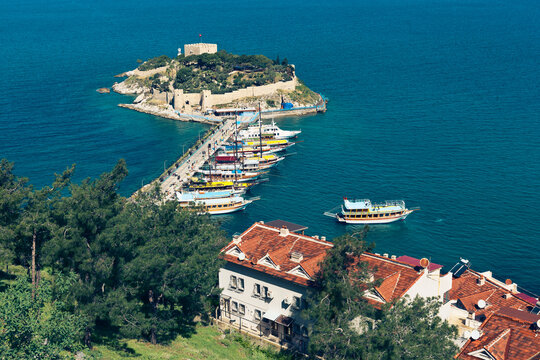 View of "Pigeon Island" and famous Guvercinada Fortress - the main tourist attraction of resort town. Kusadasi, Aydin Province, Turkey
