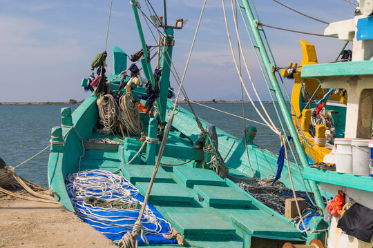 Traditional fishing boats with nets at Banda Aceh harbor