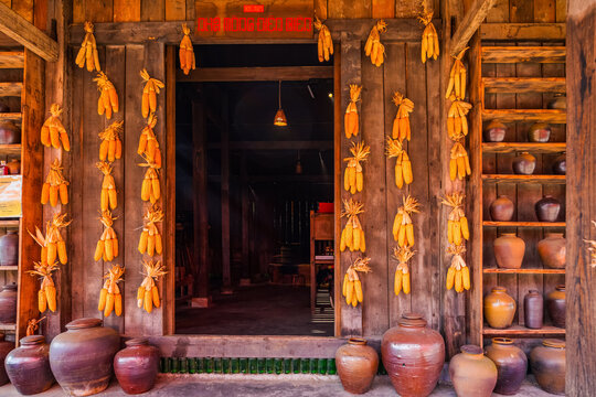 Traditional wooden house in Sapa with corn and pottery