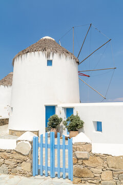 Traditional windmill and whitewashed house in Mykonos