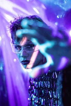 Futuristic cyberpunk woman in virtual reality neon light