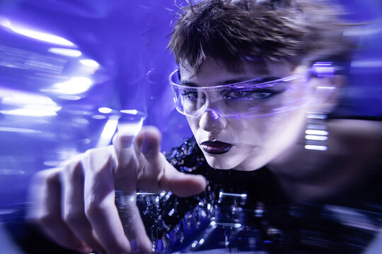 Cyberpunk young woman using virtual reality interface