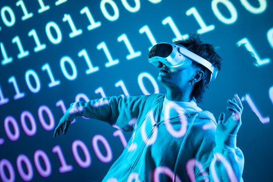 Young woman using VR headset with cyberpunk data glow