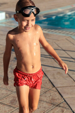 Child enjoying summer day at the resort pool