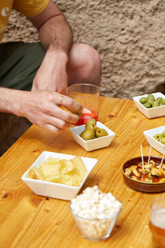 Spanish vermouth aperitif with tapas snacks on table