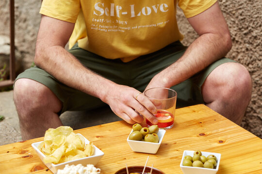 Spanish vermouth aperitif with tapas and olives on table