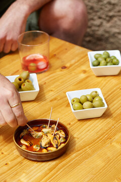 Spanish tapas with vermouth aperitif on rustic table