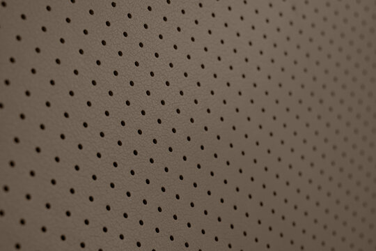 Brown textured surface with small perforations