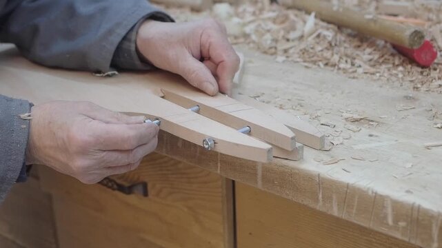 Crafting wooden tools by hand in a workshop