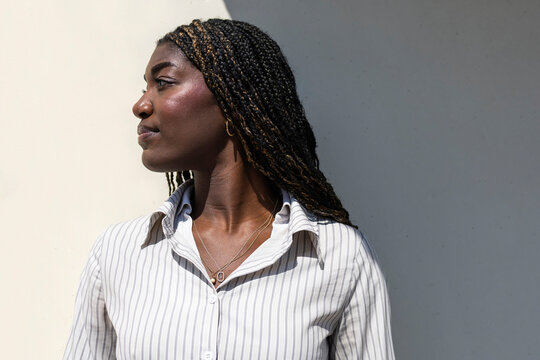 Woman with braids enjoying a sunny day outdoors