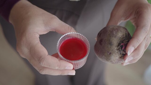 Making juice from a beet in a home kitchen