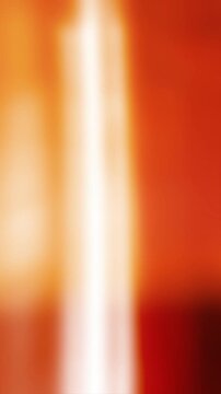 Abstract 4K distressed celluloid texture with smoky orange light wash