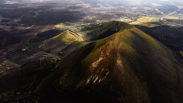 Volcanic vineyard landscape in Lanzarote under magical light