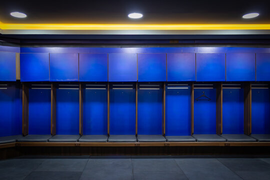 Empty locker room benches ready for team sports