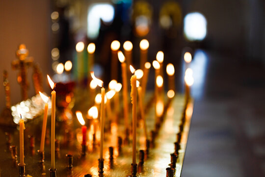 Spiritual candles lit in soft golden glow