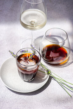 Iced coffee with summer drink on lavender plate
