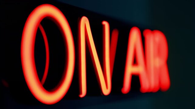 Neon Sign On-Air Studio Broadcasting Radio Podcast Live Recording Wall Dark Glowing Red. This illuminated text indicator creates a professional atmosphere