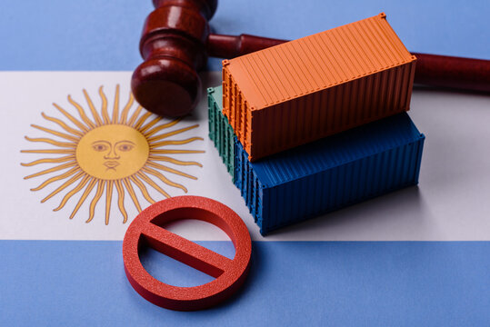 The cargo container ban on the Argentina flag as a conceptual backdrop. The cargo container embargo