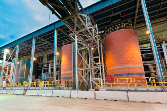 Industrial view of a CIP System (Clean-In-Place System) at a desalination plant featuring the RO Neutralization Tank, CIP Rinse Tank, and CIP Caustic Tank used for water treatment.