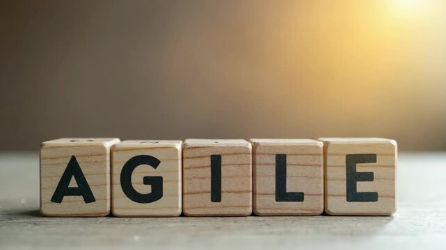 Agile Business Concept. Wooden blocks stacked vertically to spell word "AGILE"; ,representing agility in business and project management methodologies. Adaptability, innovation, mod.