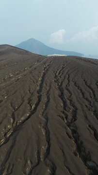 Aerial Of Tourists Hiking Up Anak Krakatau Volcano Ash Slope
