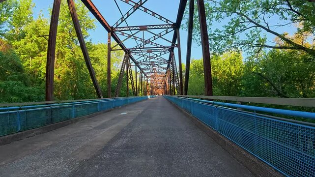 immersive POV cycling across the historic Old Chain of Rocks Bridge (Route 66) over the Mississippi River near St. Louis, Missouri. Scenic ride with sweeping river views, unique bridge design.
