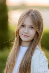 Naklejka premium portrait of a cute schoolgirl with long blond hair