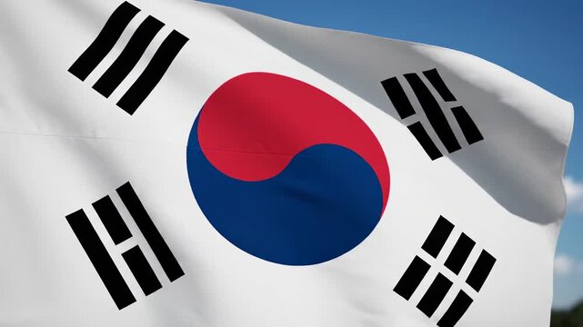 South Korean taegukgi flag, taegeuk symbol and four black trigrams waving on pole against bright blue sky with clouds, wide to close-up transition video. korean national pride and eastern philosophy