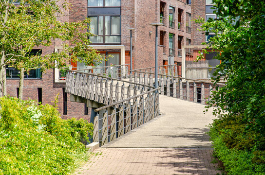 Hendrik Ido Ambacht, The Netherlands, June 9, 2026: bridge leading up to a housing complex from the beginning of the 21ste century