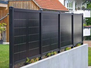innovative solar panel fence combining property boundary design with efficient renewable energy generation outdoors © Simon Dux Media