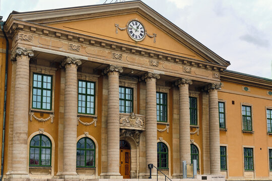 Karlskrona, Sweden - 14 September 2025: View of the neoclassical facade of the Blekinge District Court with its grand stone columns and clock on the pediment at Stortorget.