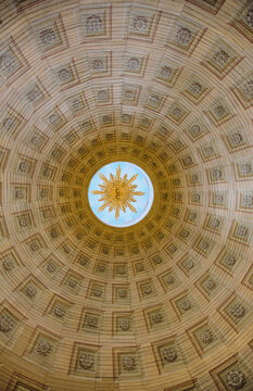 Karlskrona, Sweden - 14 September 2025: View of the ornate interior dome of the Church of the Holy Trinity featuring a golden sunburst symbol in the central oculus.