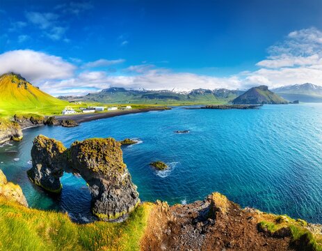 panoramic view on impressive icelandic seascape majestic view on famous arnarstapi village of sunny day saefellsnes peninsula amazing nature of iceland popular travel and hiking destination place