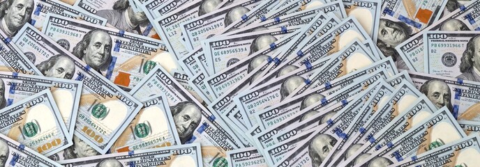 Fototapeta premium Large amount of banknotes of hundreds of US dollar currency bills. Pile of USA cash