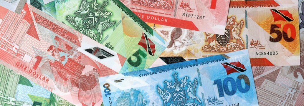 Trinidad and Tobago dollar money banknotes bunch on table. Trinidad and Tobago bills of TTD currency