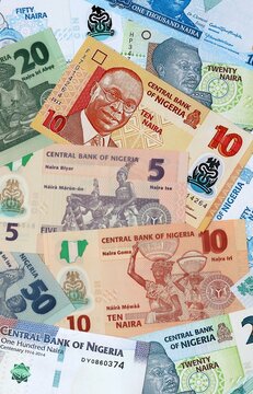 Nigerian naira money banknotes bunch on table. Nigeria bills of NGN currency close up