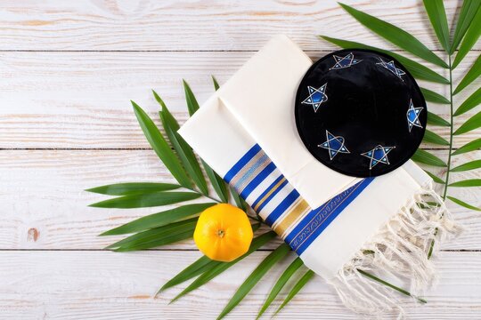 Jewish prayer shawl tallit orange etrog and kippah.