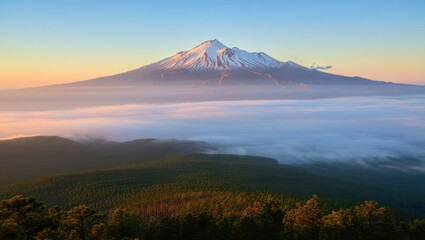 Fototapeta premium Majestic snowy mountain peak above clouds.