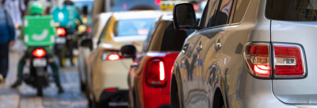 Heavy traffic jam with multiple cars stuck in congestion on busy urban road, city rush hour, transportation delay, and everyday metropolitan mobility struggle concept.