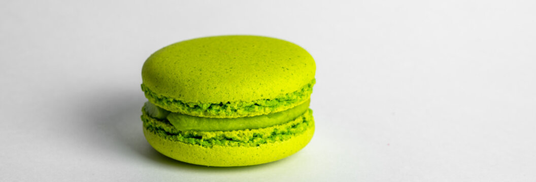 A pistachio macaroon with a chewy, delicate texture and nutty, rich pistachio flavor, perfect as a sweet treat, dessert, or elegant snack.