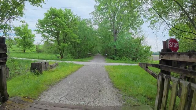 Immersive POV from a bike ride on KATY trail near Hermann, Missouri - springtime morning after heavy storm